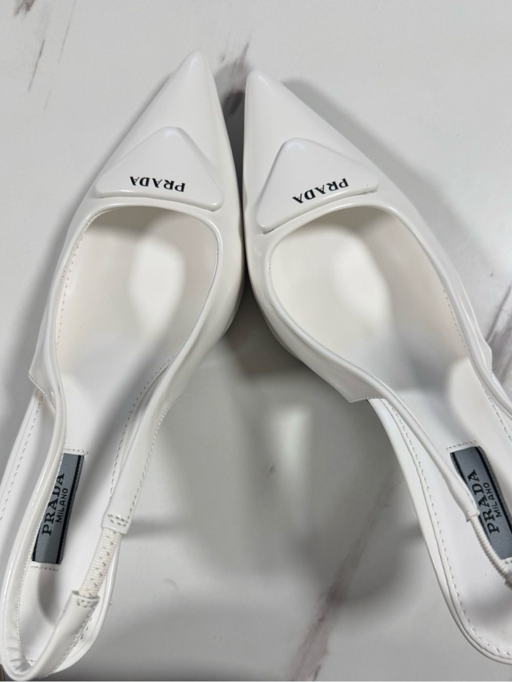 Prada White Pointed Slingback Pumps with Logo Plaque